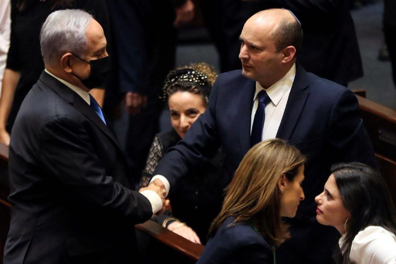 Former PM Benjamin Netanyahu congratulates new PM of Israel Naftali Bennett after the vote for the new government in Knesset on June 13, 2021.