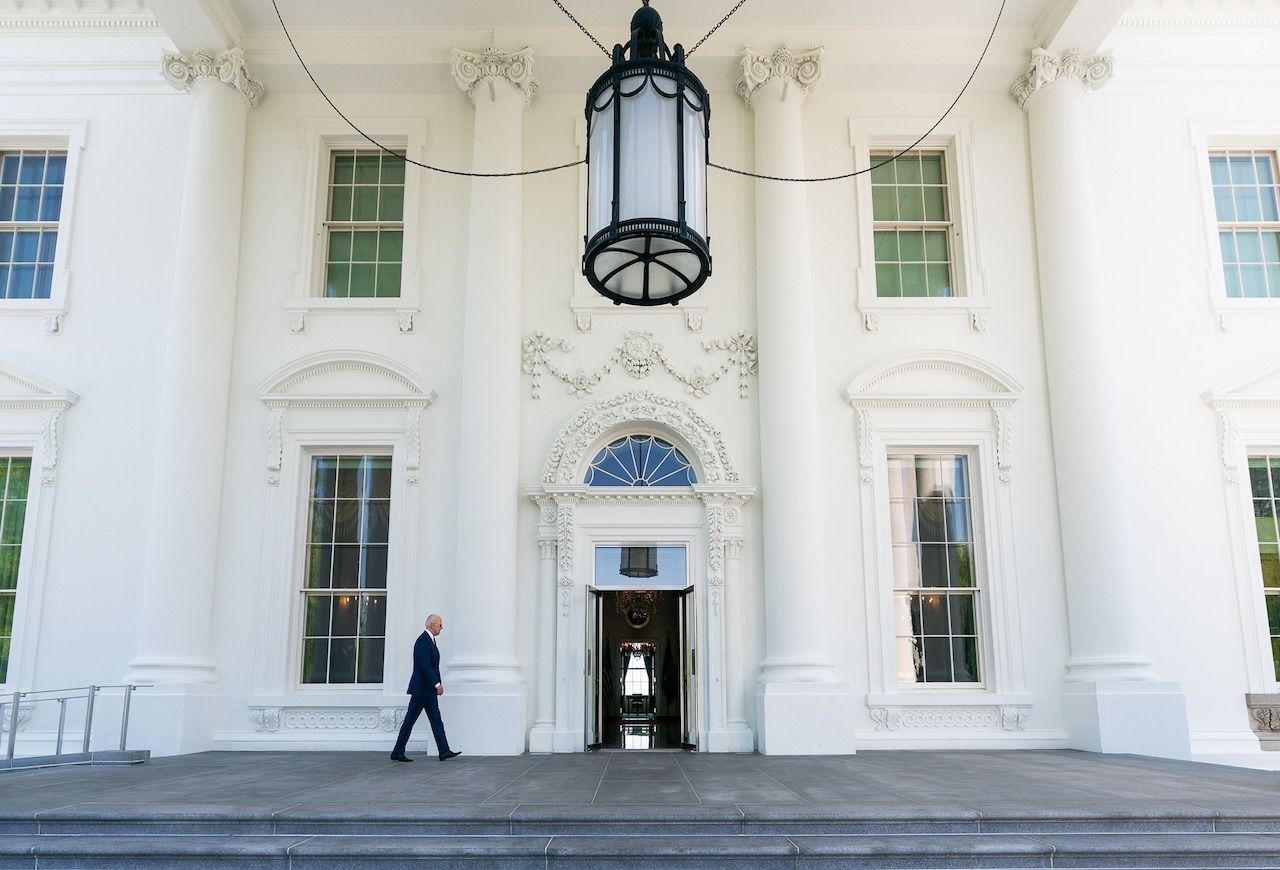 US President Joe Biden at the main entrance to the White House.