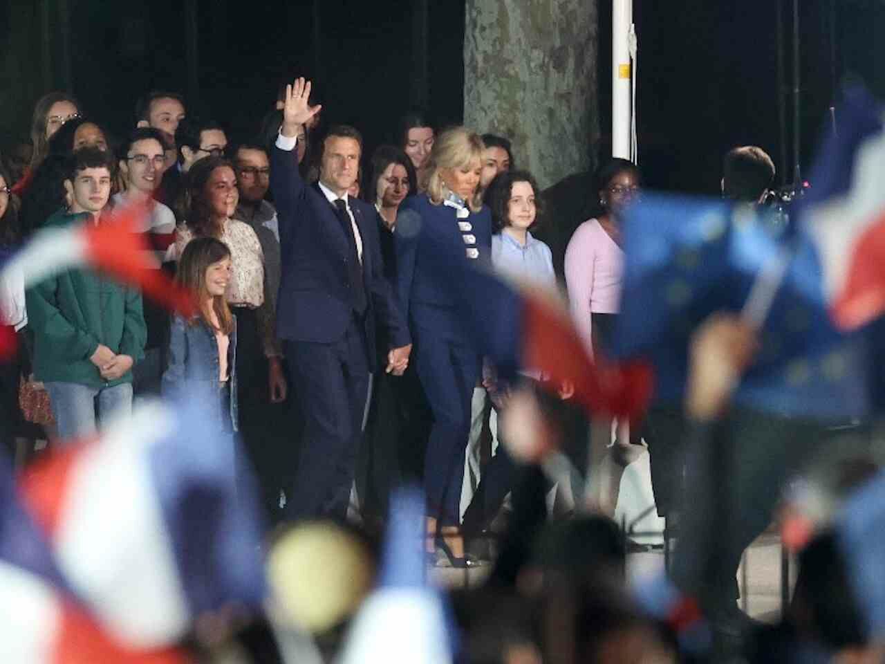 French President Emmanuel with his wife Brigitte are greeting supporters on the Champs-de-Mars.