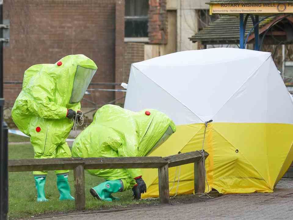 Police investigators in the anti-radioactive gear at the Skripal's house in Salisbury.